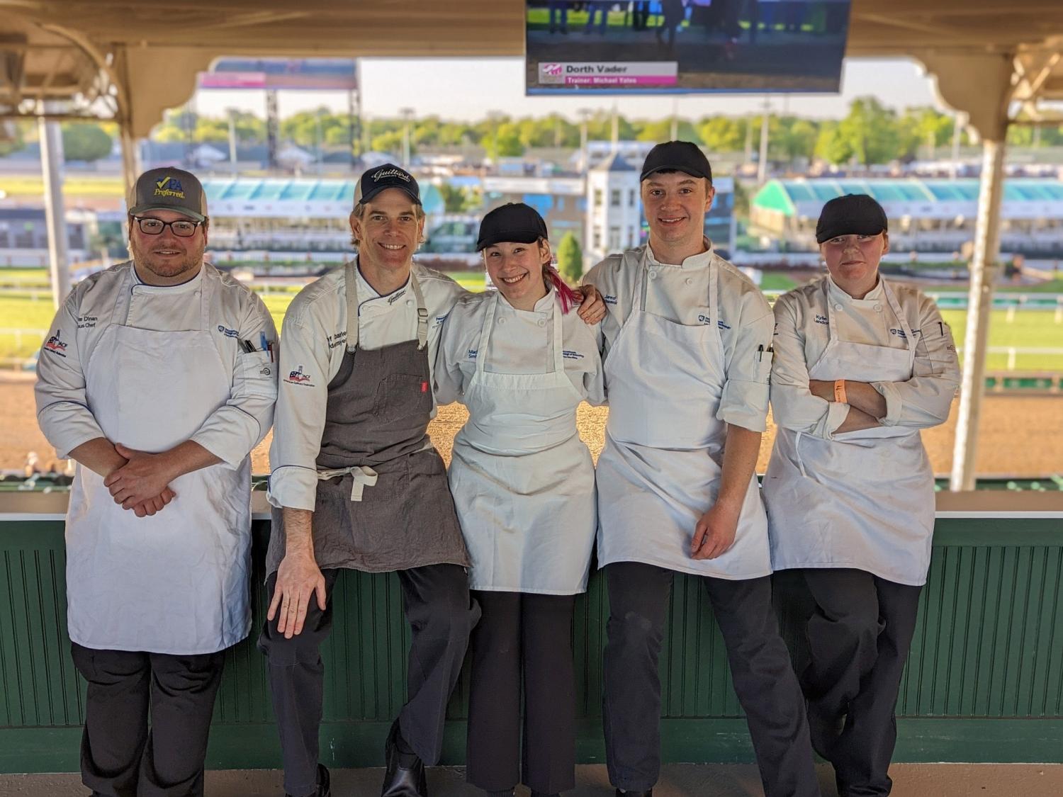 Pennsylvania College of Technology employees and students pause for a photo at Churchill Downs race track.