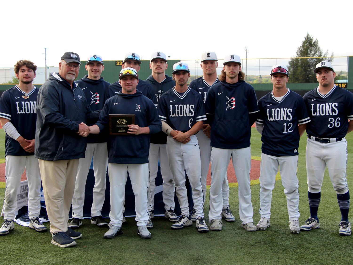 Members of the Penn State DuBois baseball team accept the runner up plaque for the 2025 PSUAC baseball season following the championship series at Showers Field in DuBois.