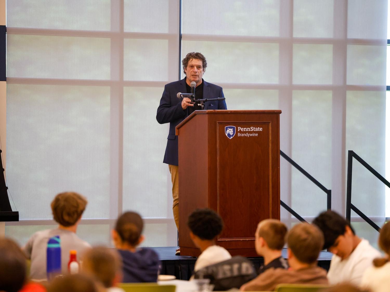 tony mattei speaking on stage