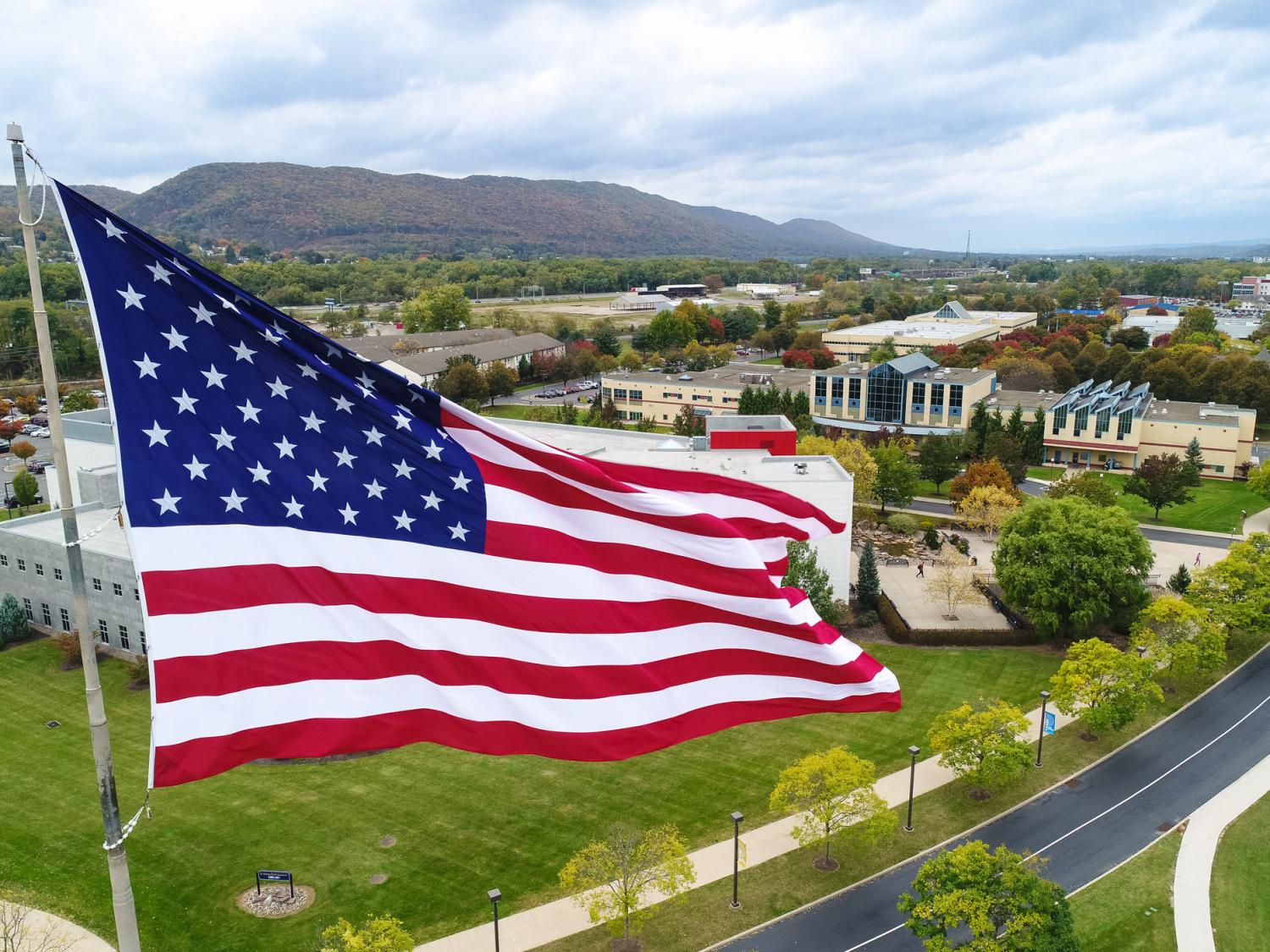 An American flag flies high over Penn College's campus in Williamsport.