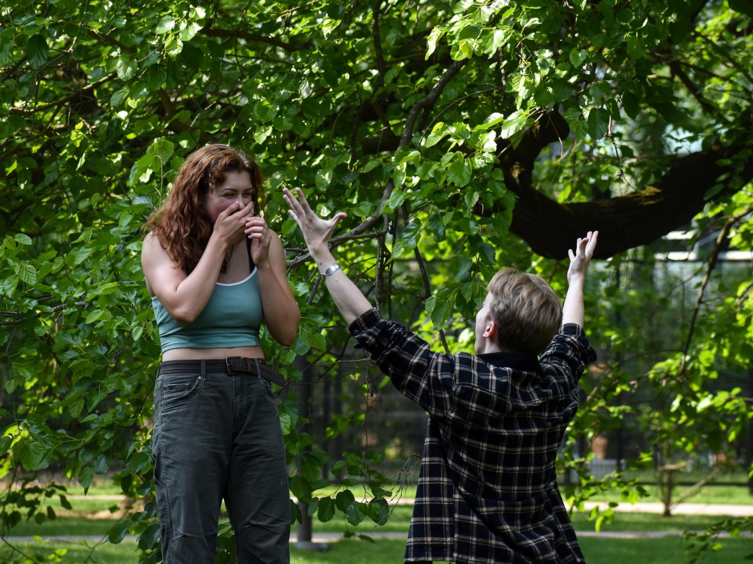 A male and female student rehearse a theater scene.