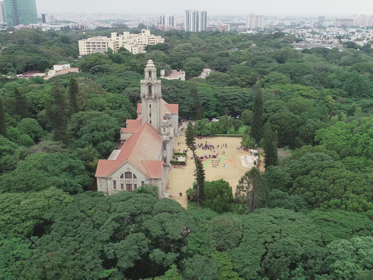 An aerial image of a building in the forest