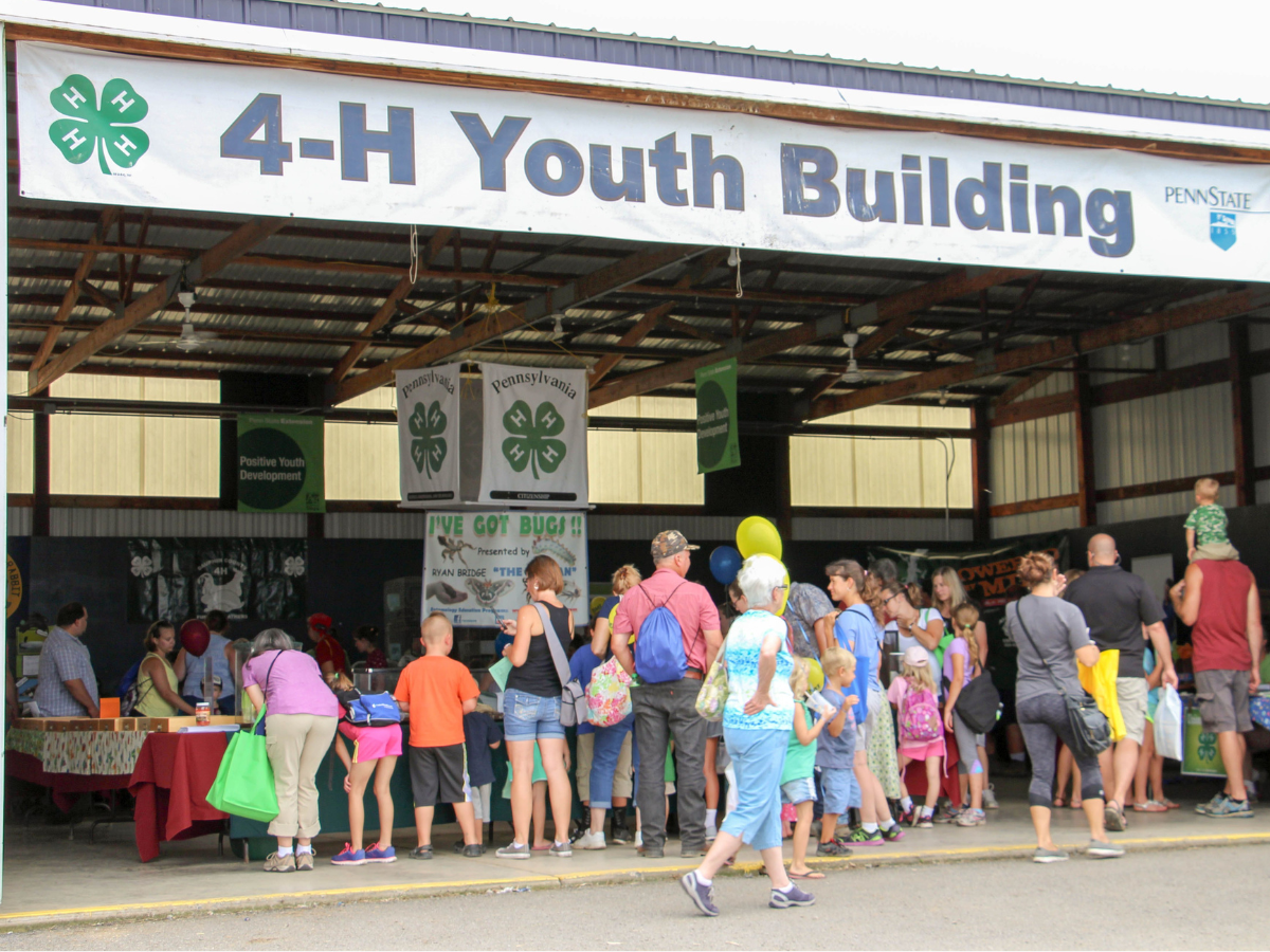 The 4-H and Youth Building with visitors at Ag Progress Day