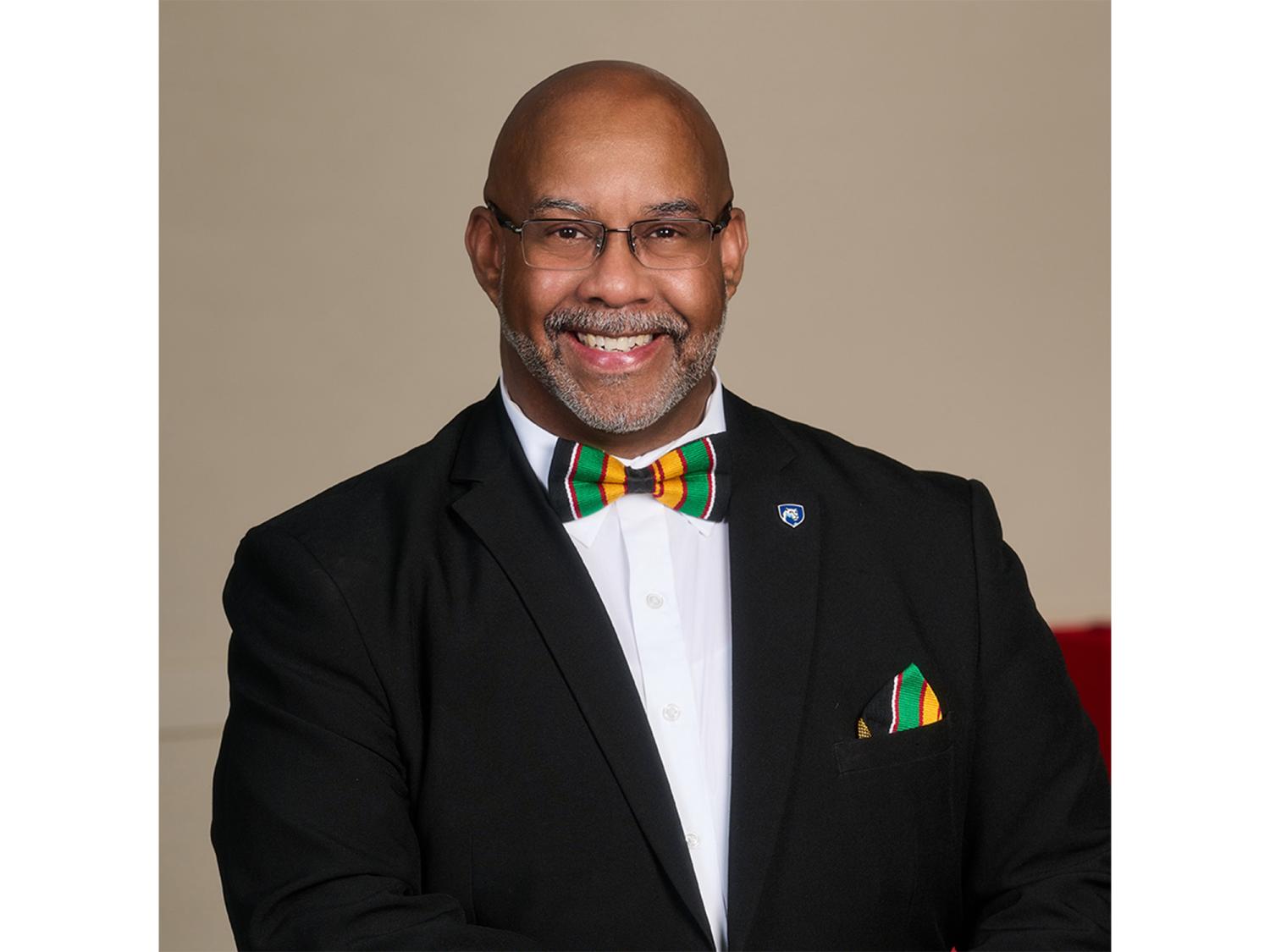 Portrait of a person wearing glasses and a bowtie