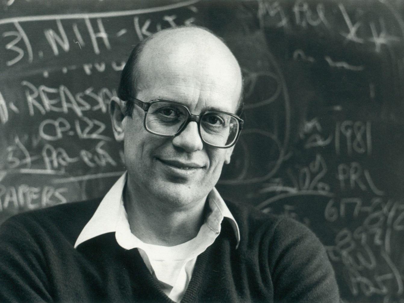 Wesley Hymer in front of chalkboard