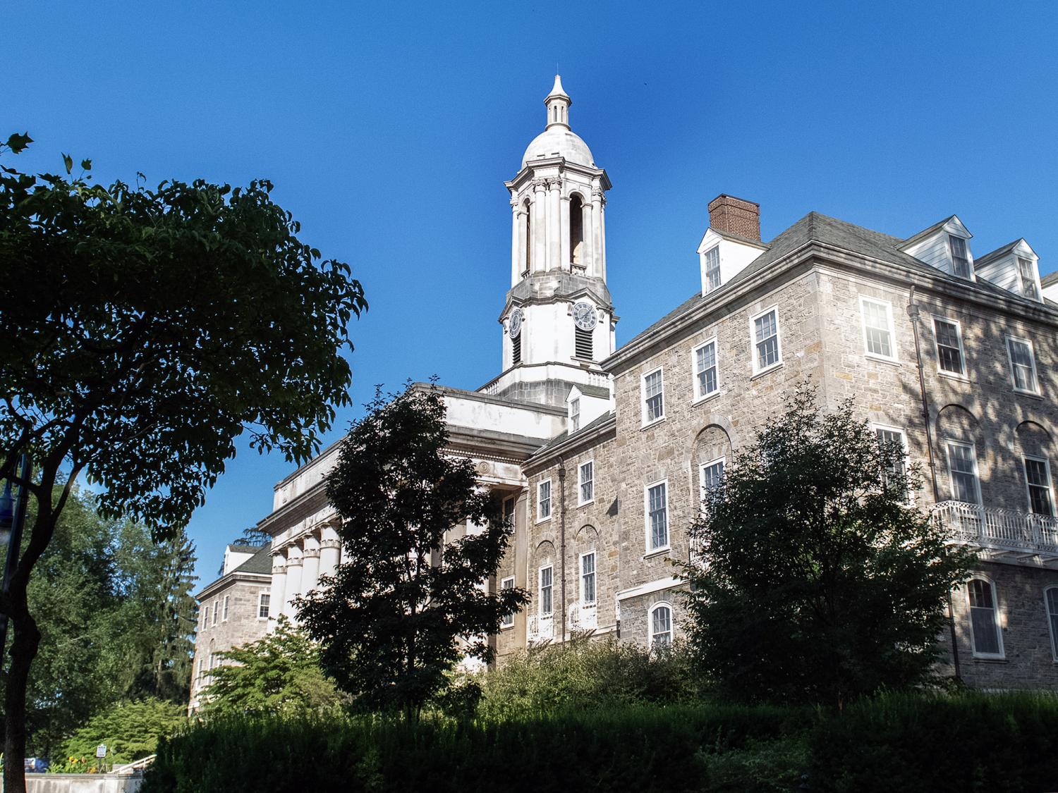 Old main with trees in shadows