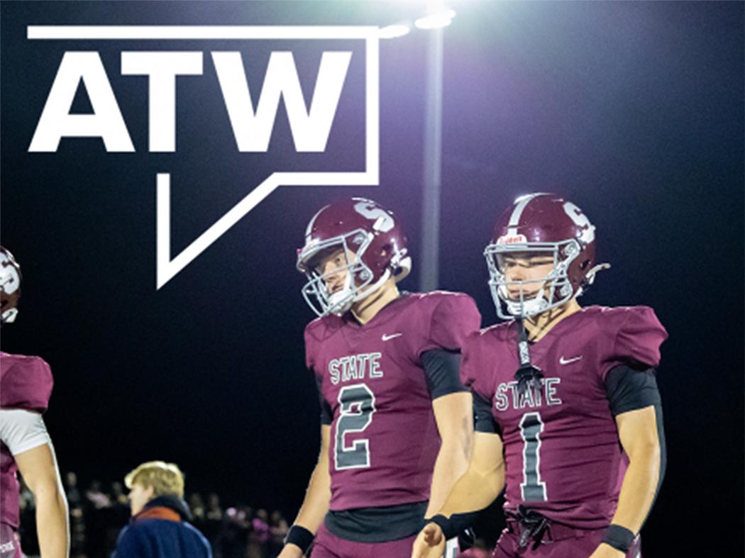 Two football players in maroon uniforms