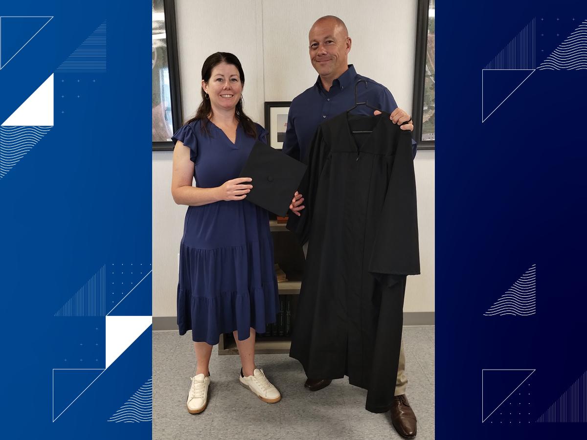 Professor Jennifer Murphy shares donation with Jeffrey R. Smith, warden of the Berks County Jail System