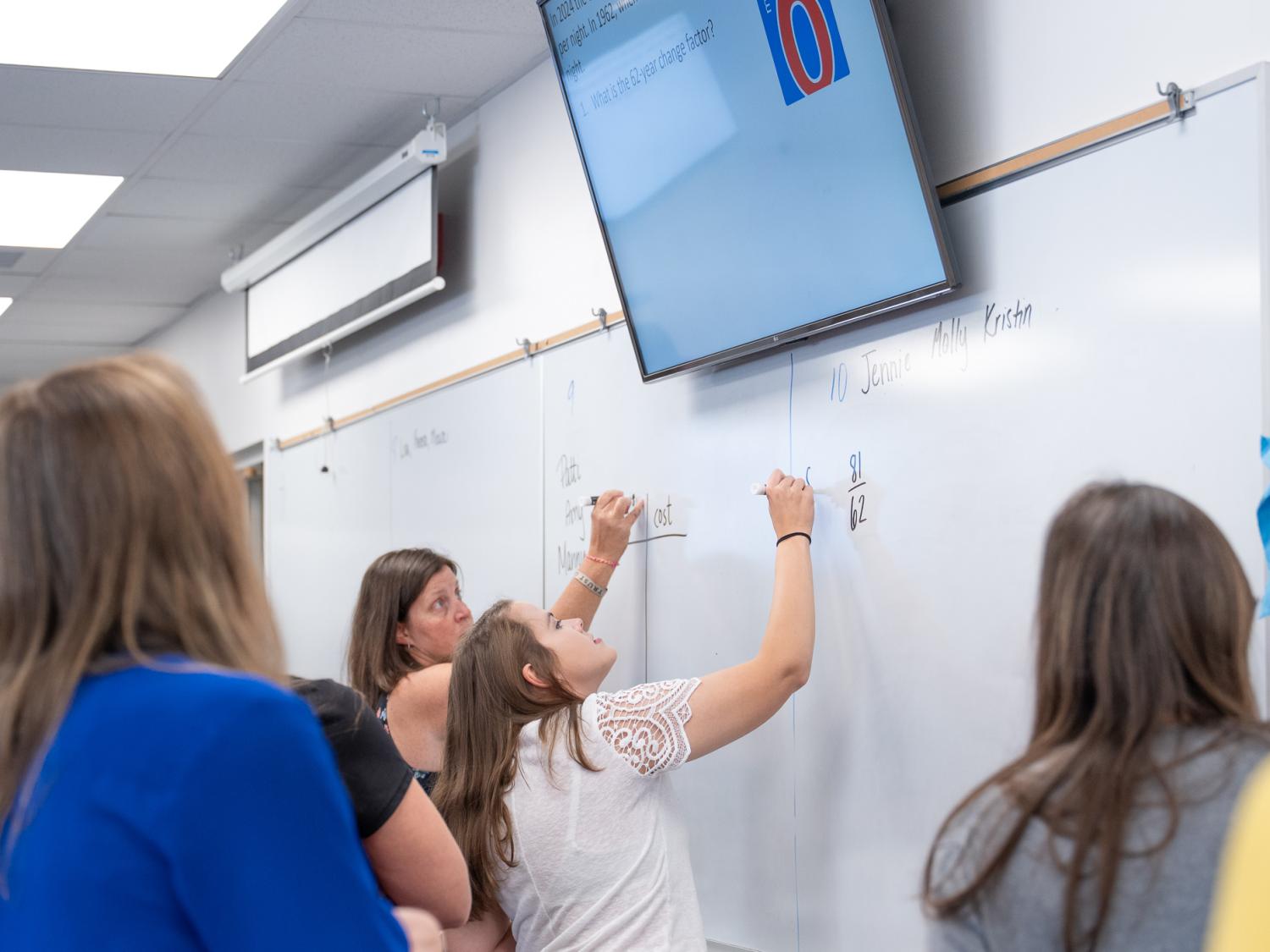 An instructor teaches in a classroom