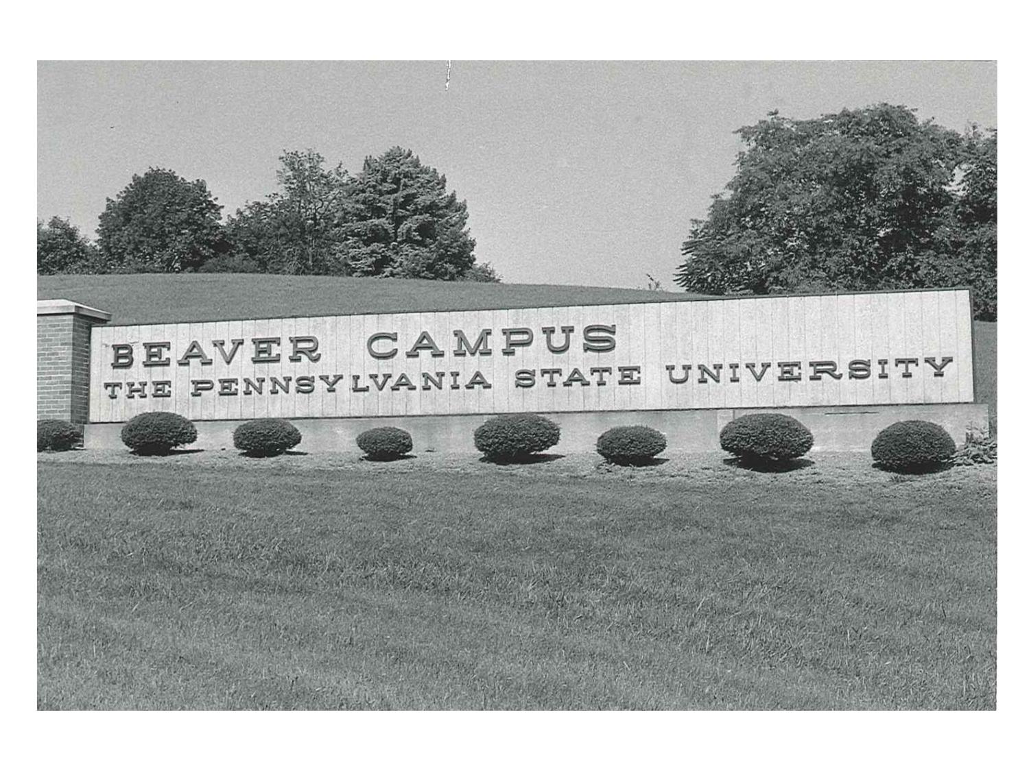 A black and white photo of the original entrance sign to campus that says Beaver Campus The Pennsylvania State University 