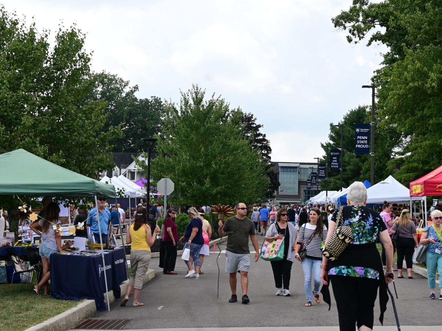 A group of attendees walking outside during a past Summer Arts Festival 