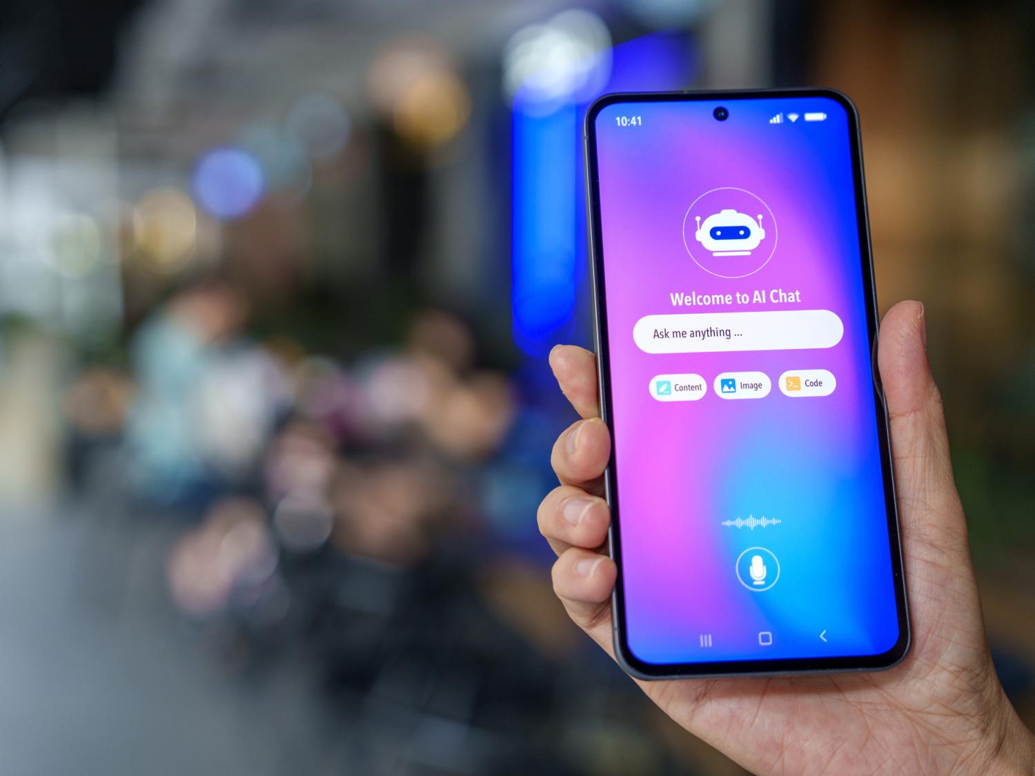 Close-up of a smartphone in a hand, showing an AI chatbot interface