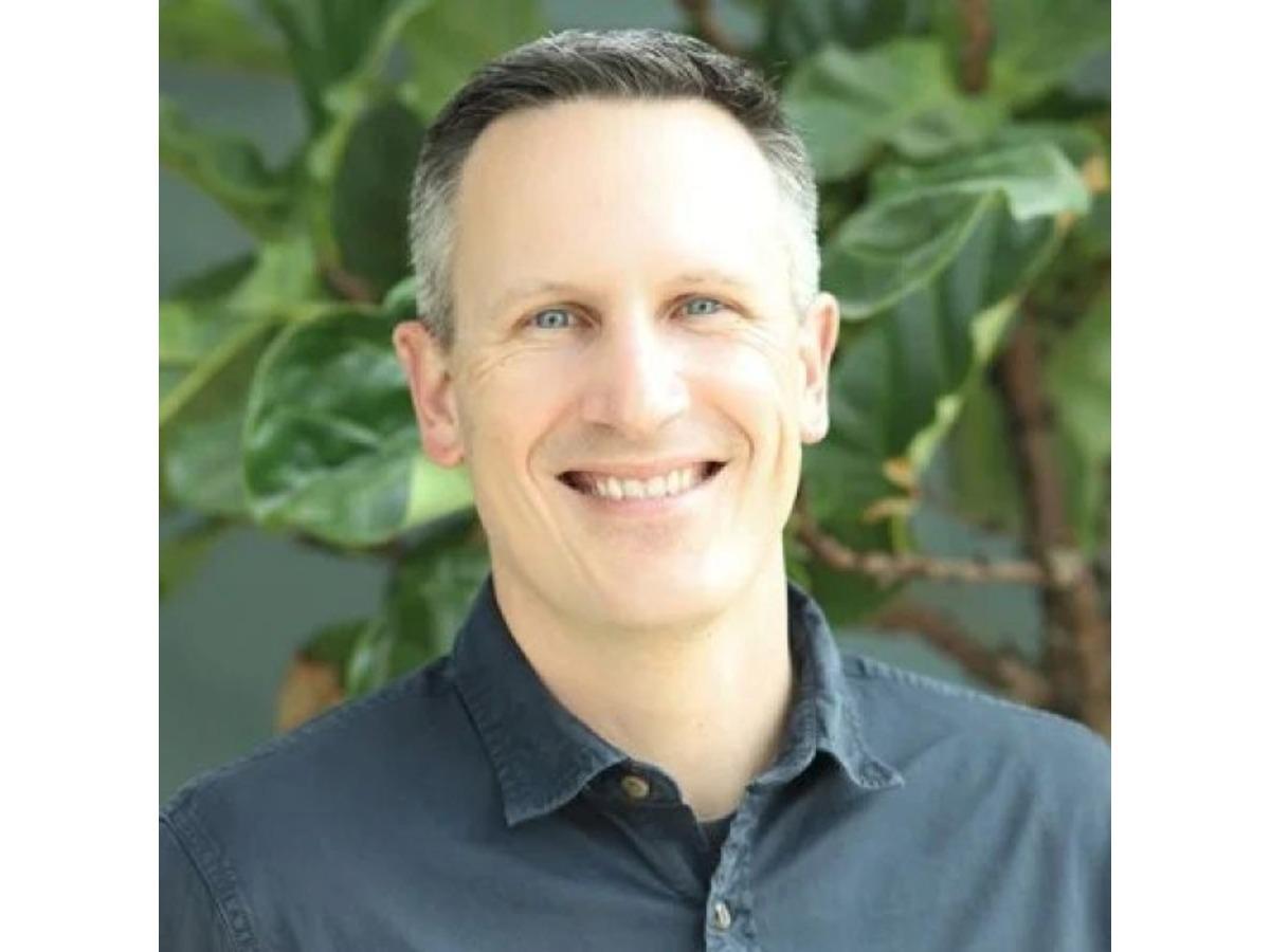 Headshot of Adam Hughes