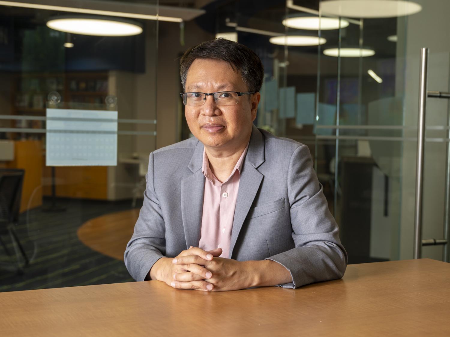 Finance professor Pornsit Jiraporn sits in the library at Penn State Great Valley.