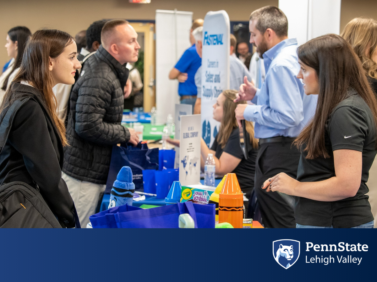 a Penn State Lehigh Valley student speaks with a job recruiter at the Business and Technology Job Fair