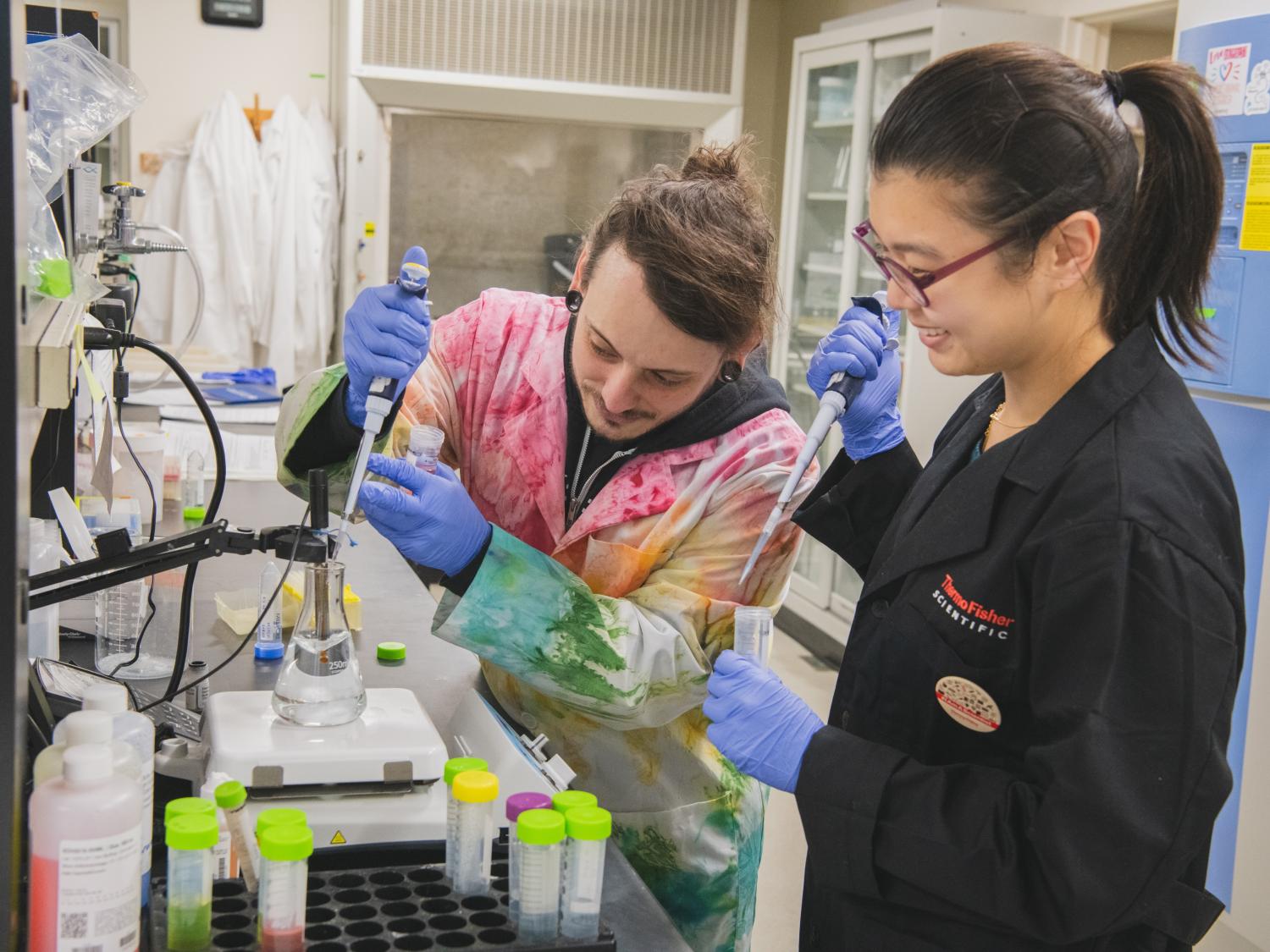Chad Smies, 5th year graduate student, and Jiyeon (Joan) Baek, postdoctoral scholar, pH a solution that will be used to visualize protein expression in the mouse brain. 