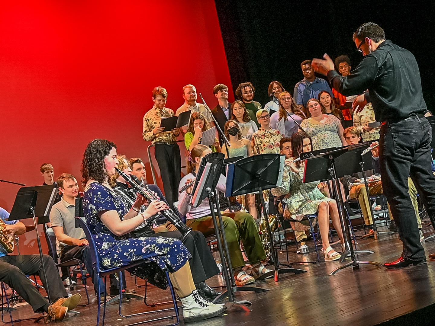 Penn State Harrisburg choir and concert band perform on stage
