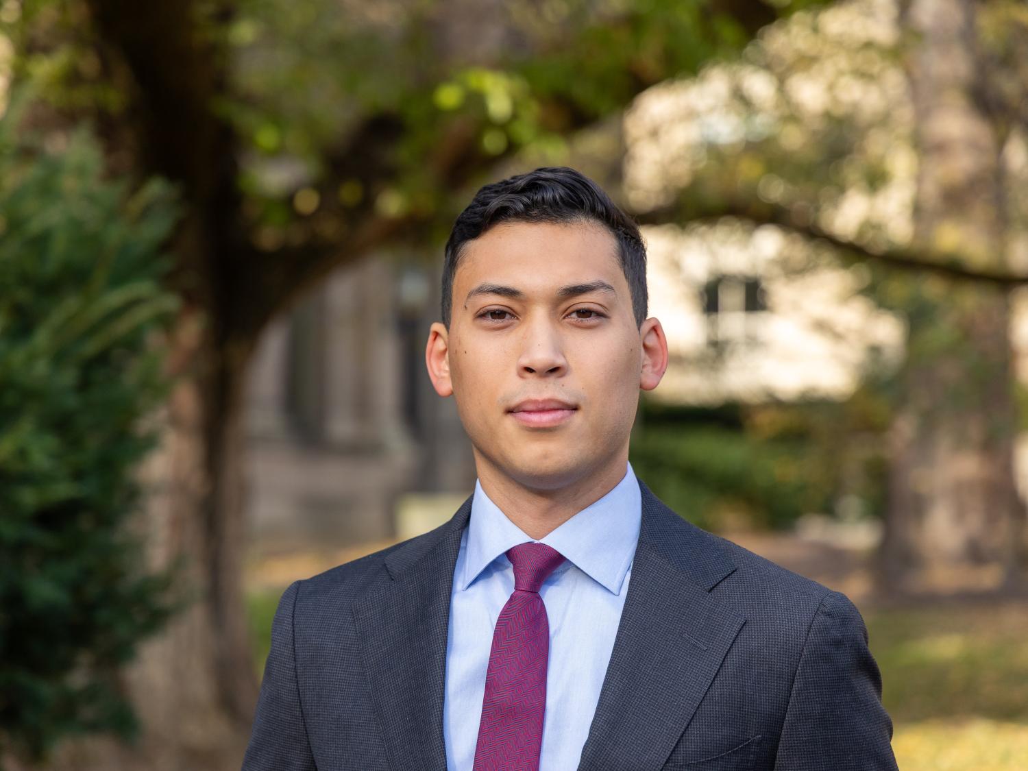 Ahmed Al Saleh stands outside Sparks Building in University Park on a fall day.