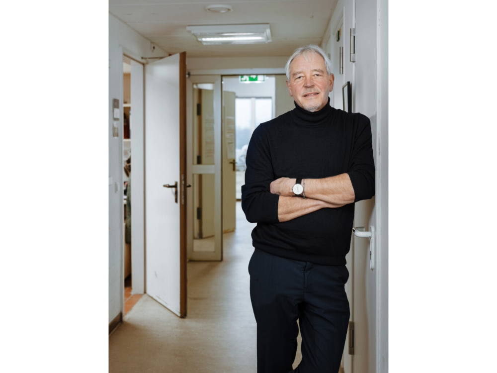 Thomas Bosch stands in front of a hallway.