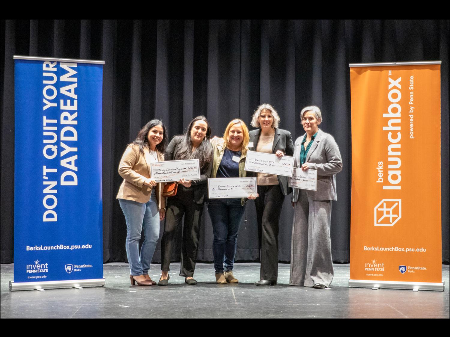 Winners of the Berks LaunchBox IdeaTest Lab pose on stage.