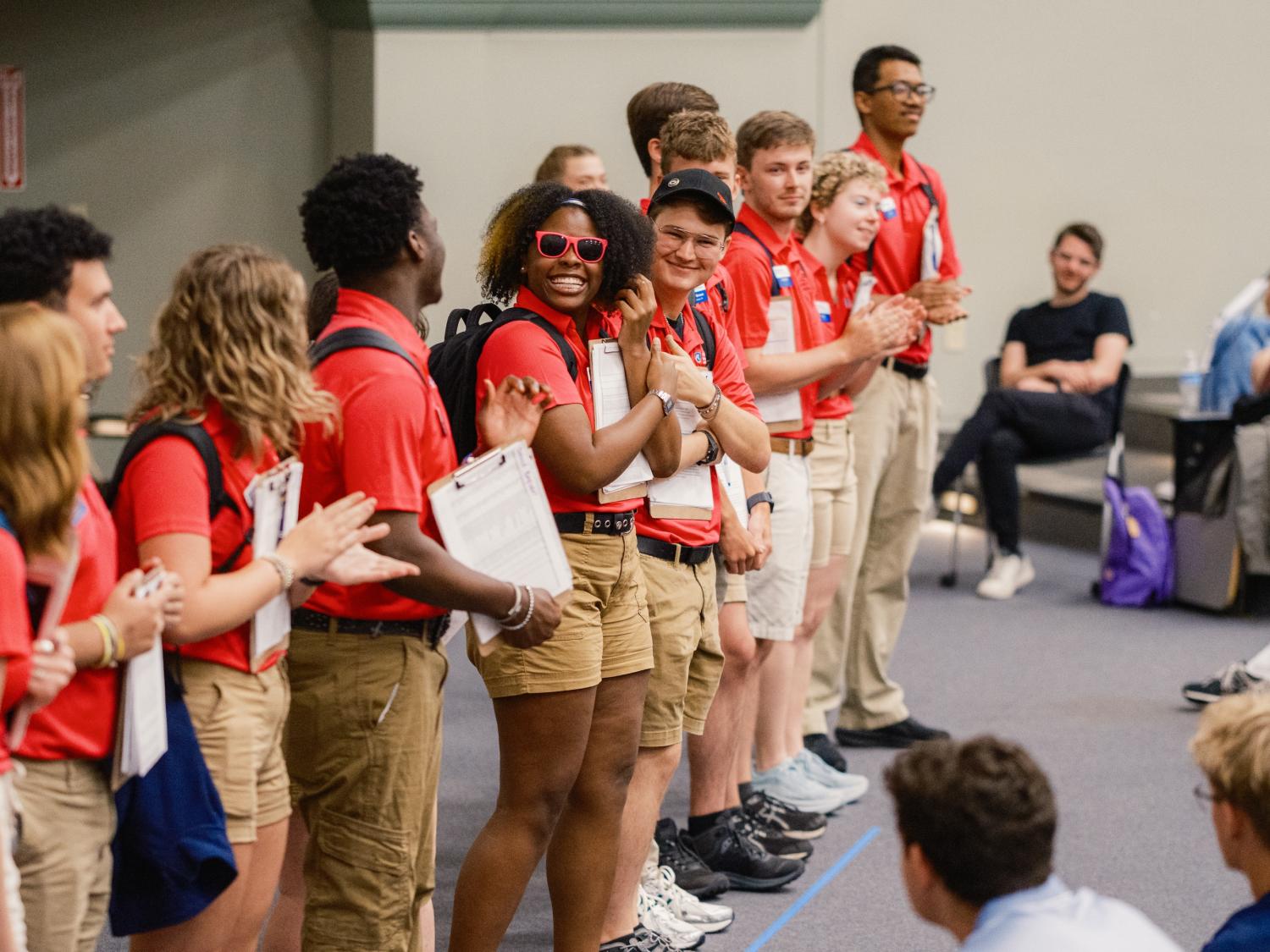 Orientation leader standing in a line