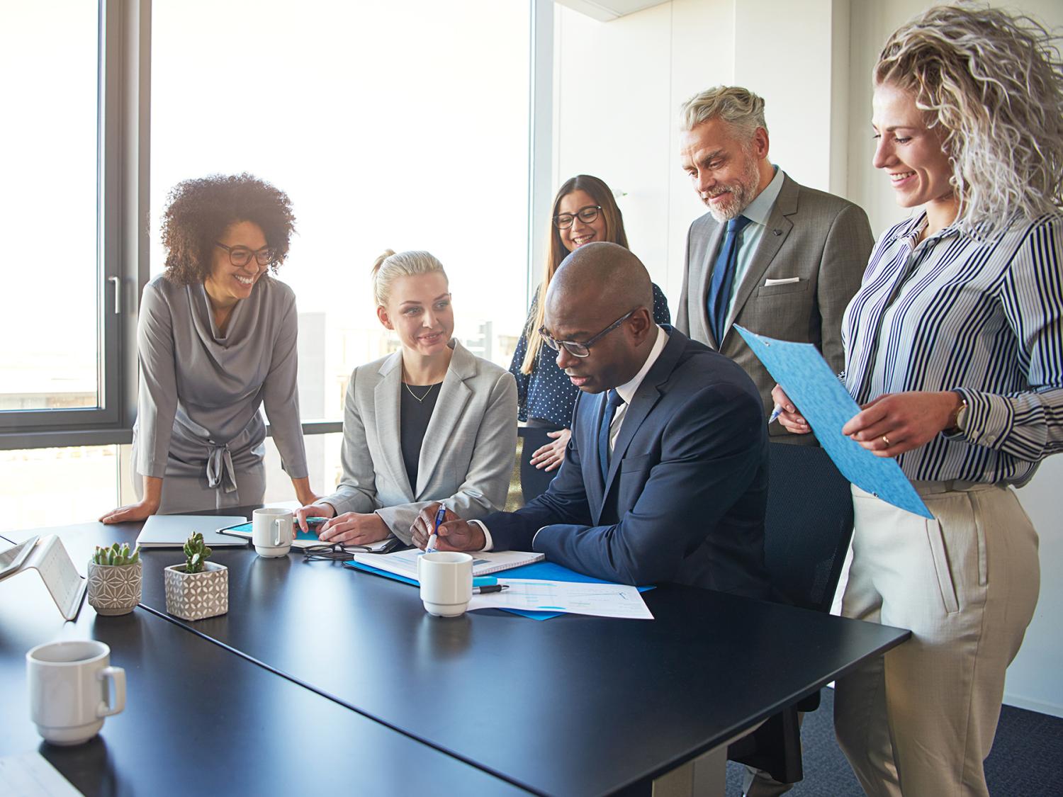 People gathered around a desk