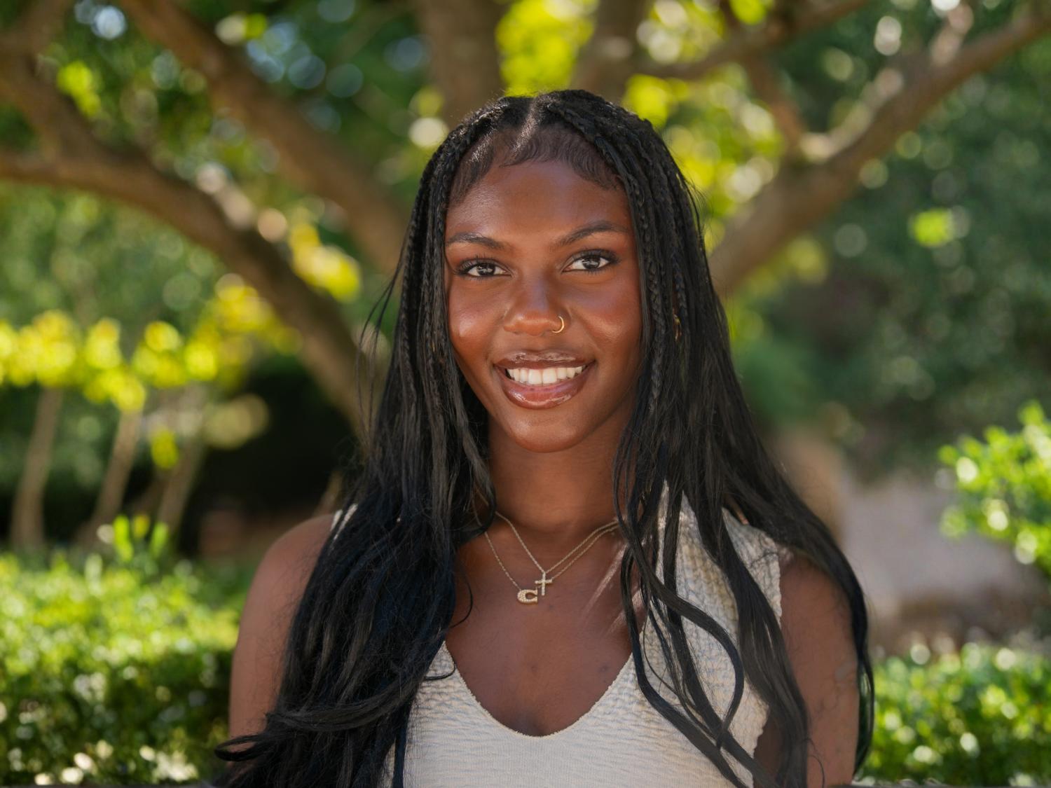 Camren Boyogueno stands by the entrance to Sparks Building.