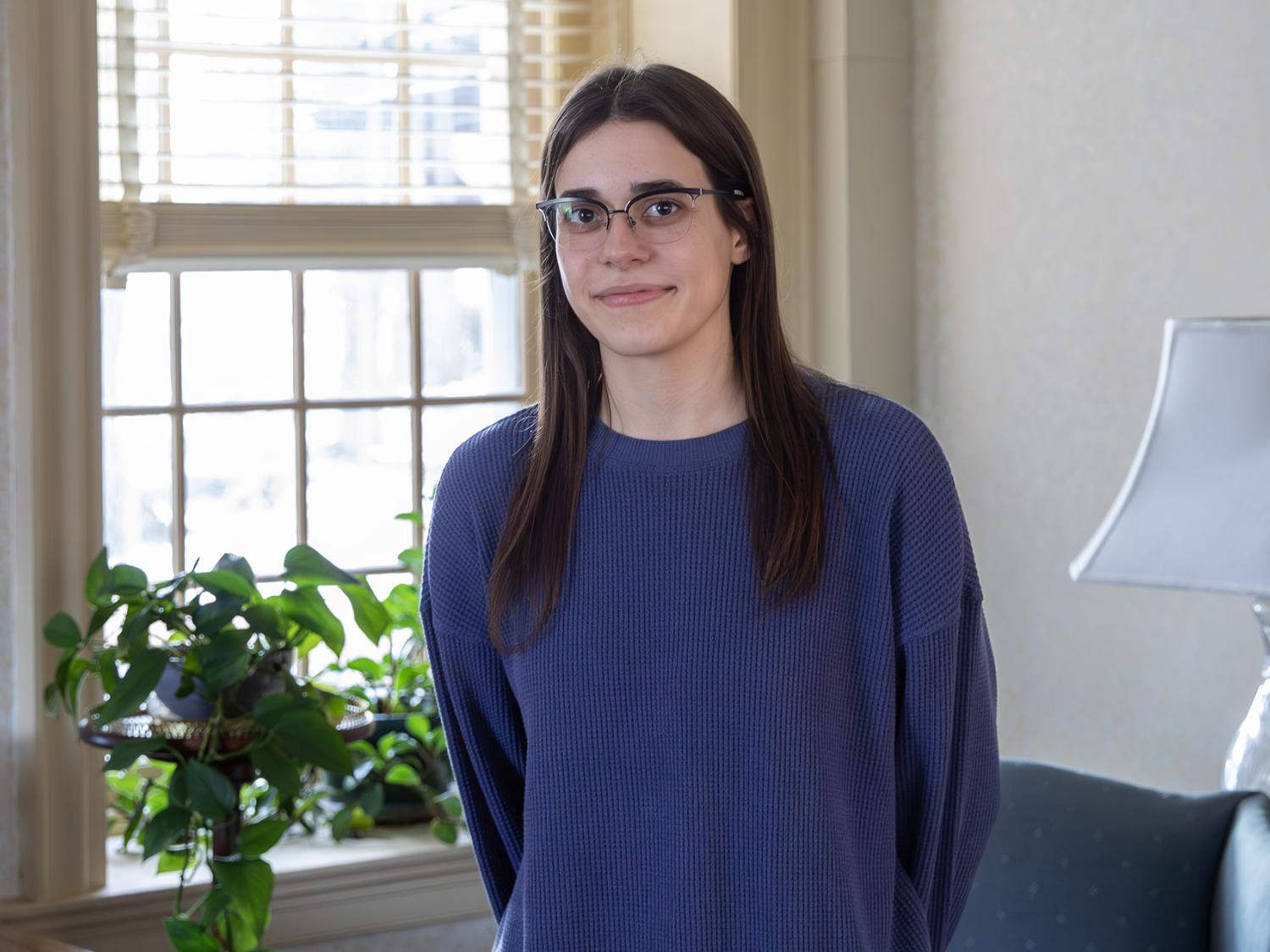Emma Pehote in the living room of the Janssen Office Building