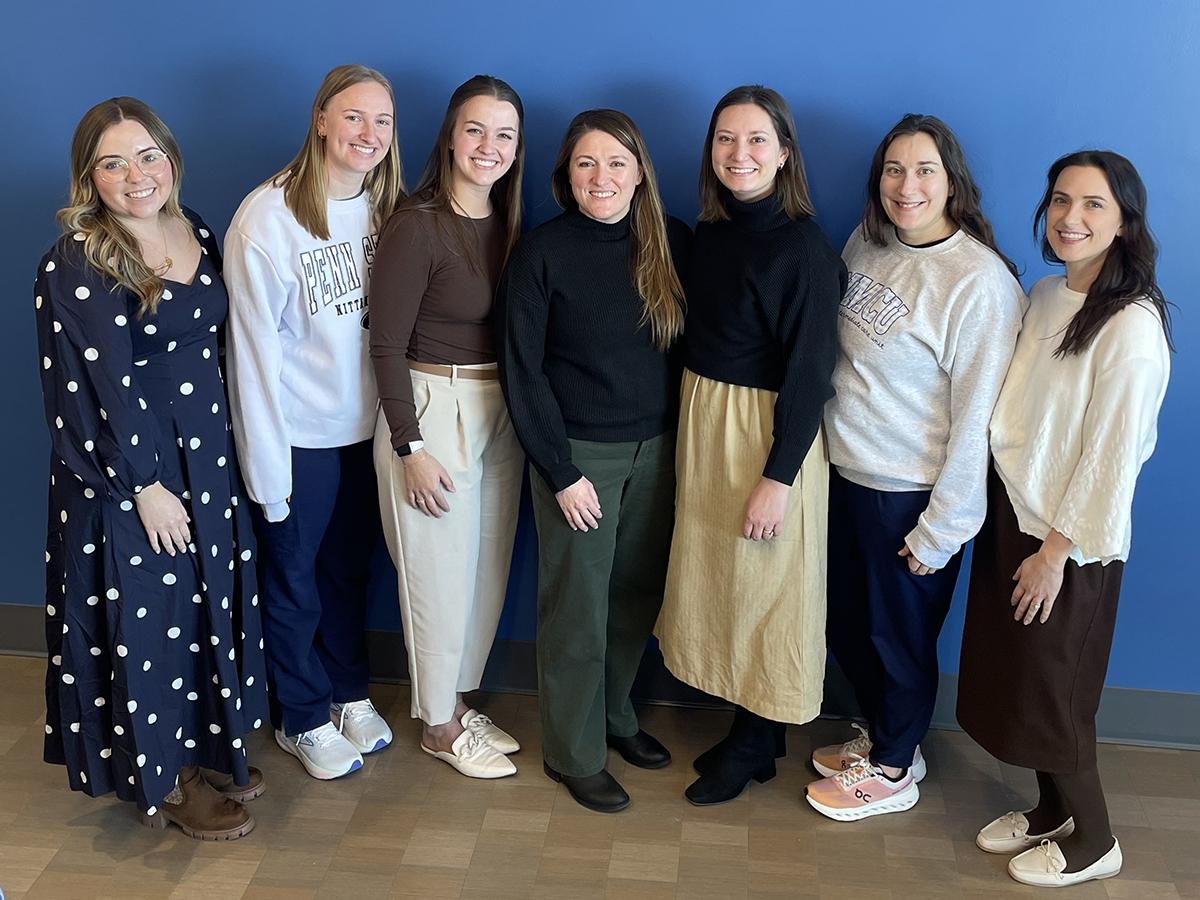 Seven members of the Pediatric Intermediate Care Unit at Golisano Children’s Hospital smile in a group photo.