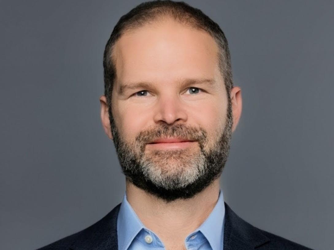 Headshot of Ran Shorrer wearing blue sportcoat and shirt 
