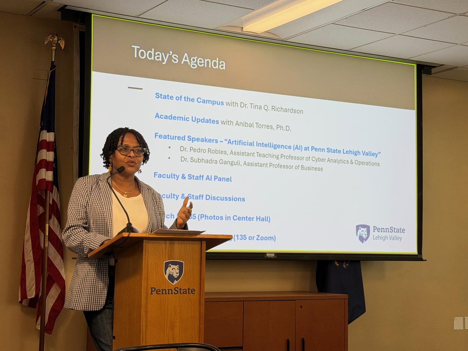 Penn State Lehigh Valley Chancellor Tina Richardson standing at a podium in front of a projection screen