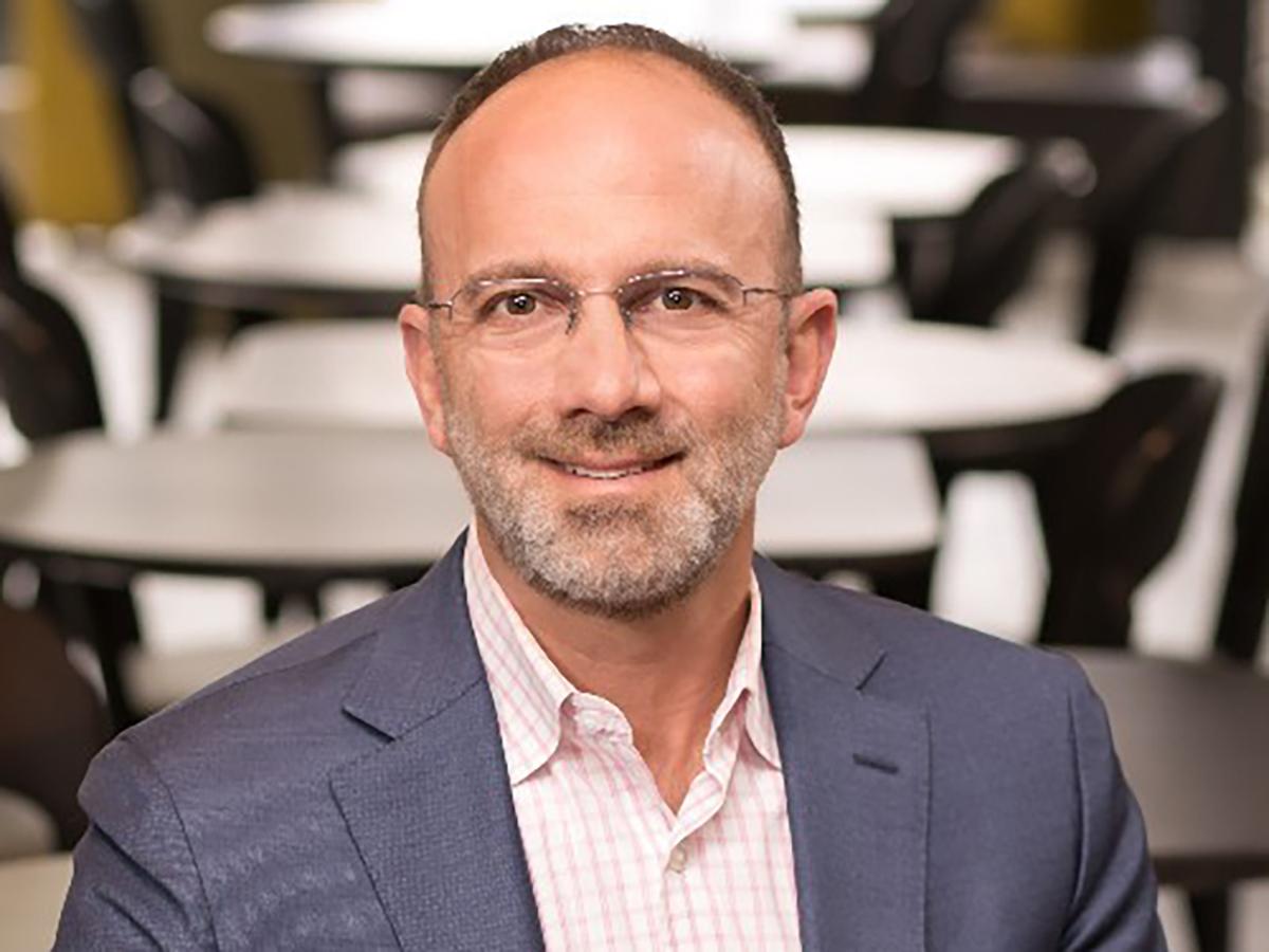 A head and shoulders photo of Gary Brandeis, who is wearing glasses and sporting a beard.