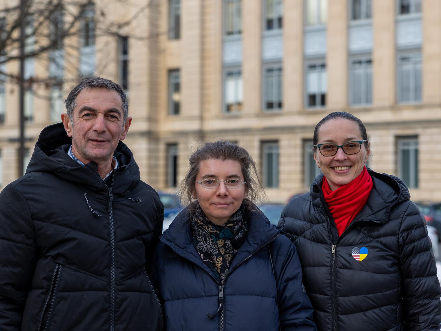 From left, Oleksandr Gon, Mariia Grytsenko and Yuliya Ladygina gather outside on Penn State's campus. 