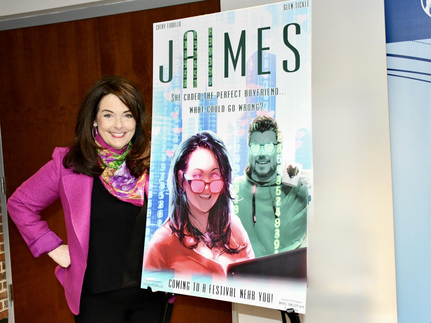 Cathy Fiorillo stands next to a poster