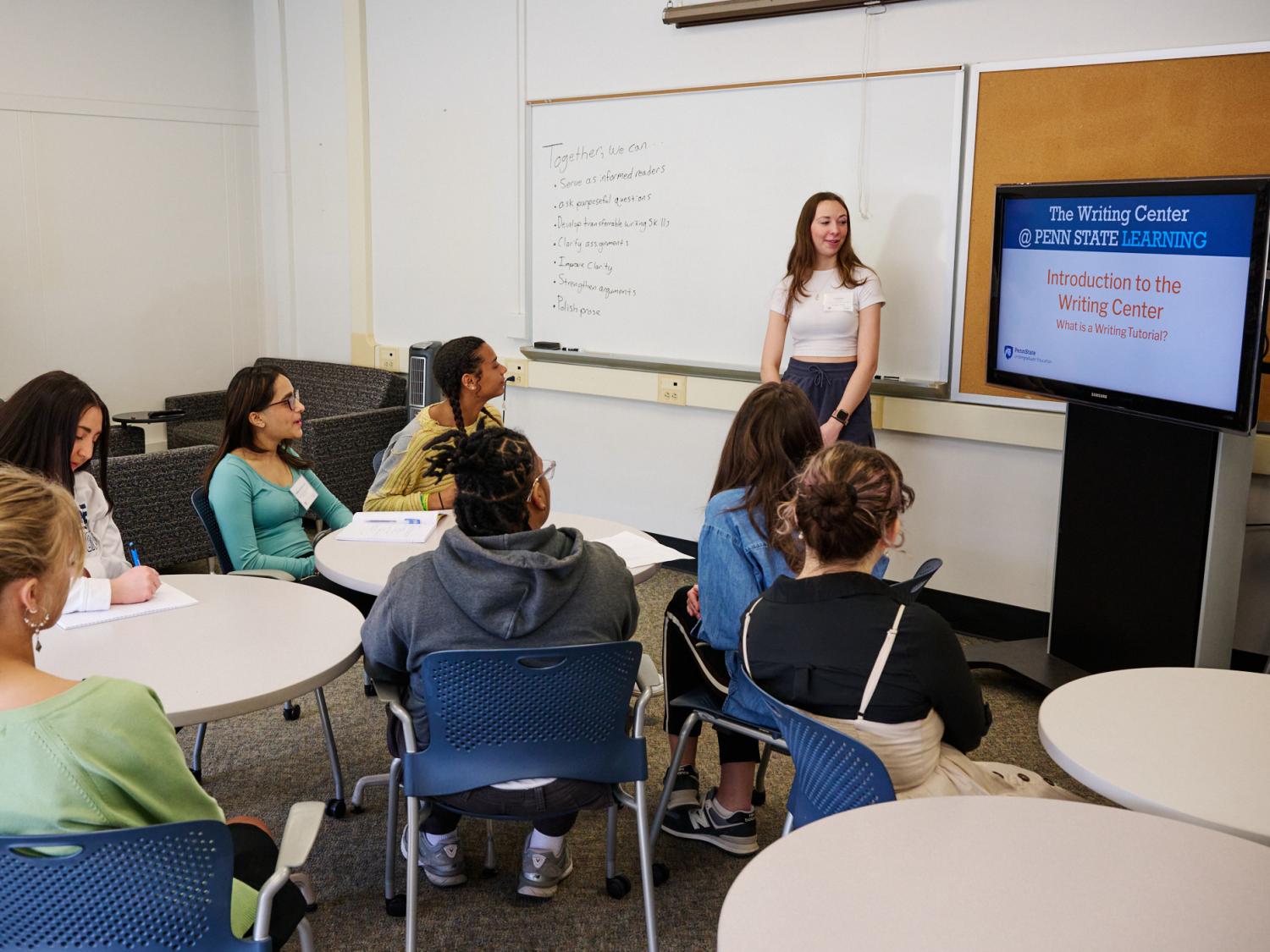 Student tutor at Writing Center presents to classroom full of students