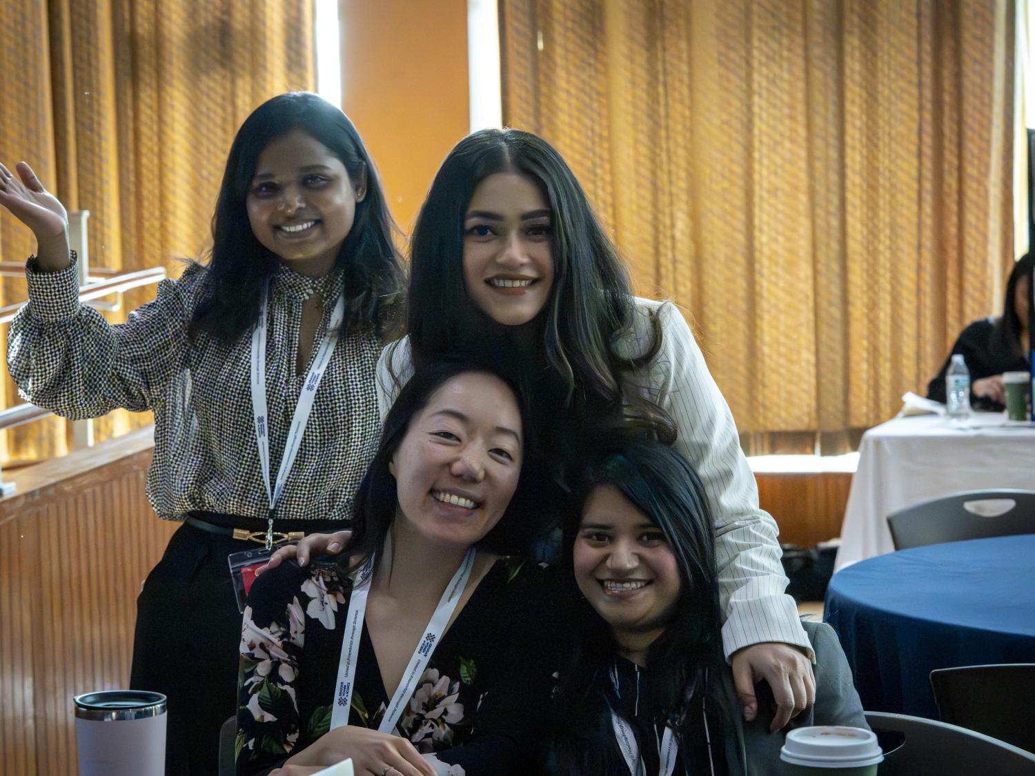 Group of four organizers of the Empower Conference posing for a photo.