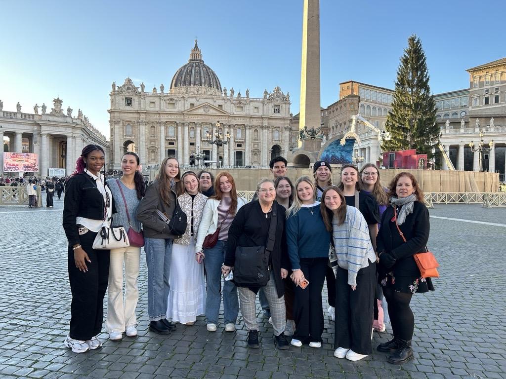 A group of students studying abroad pose for a picture in Florence, Italy