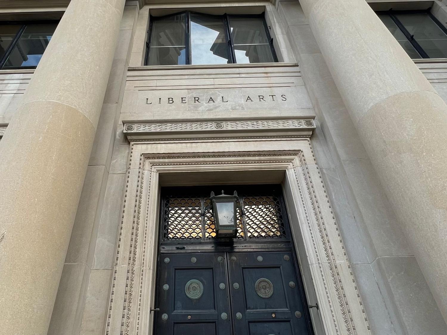 the words 'liberal arts' appear over a door that is flanked by columns