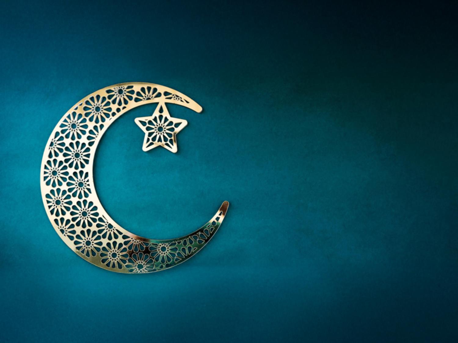 Crescent moon and star on turquoise background
