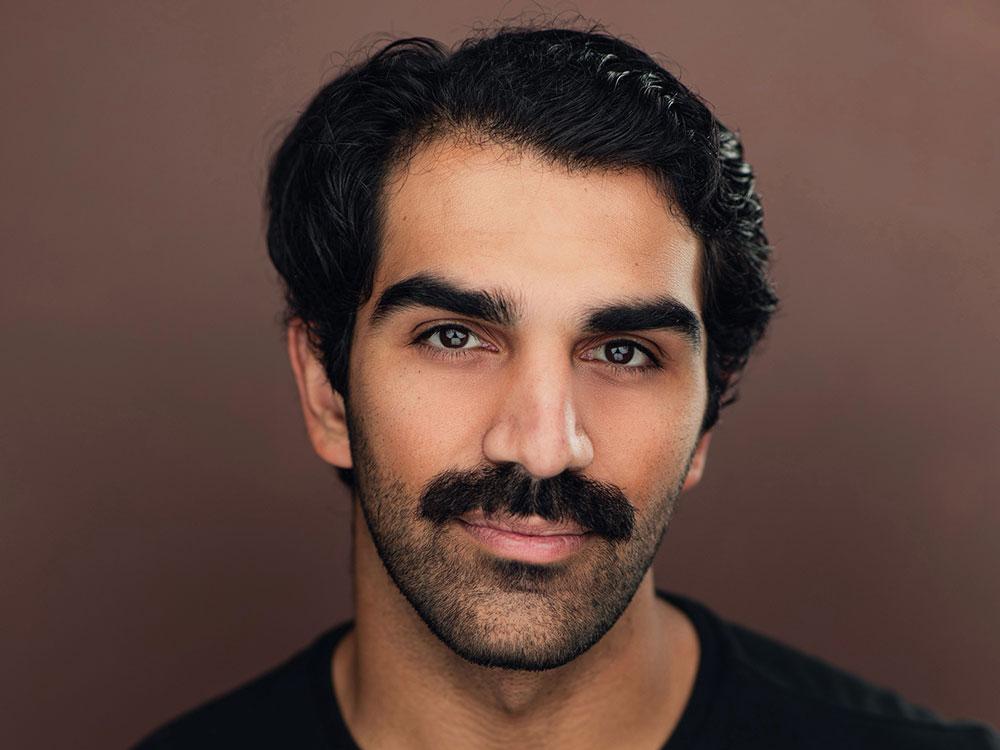 A portrait photo of smiling Ryaan Farhadi