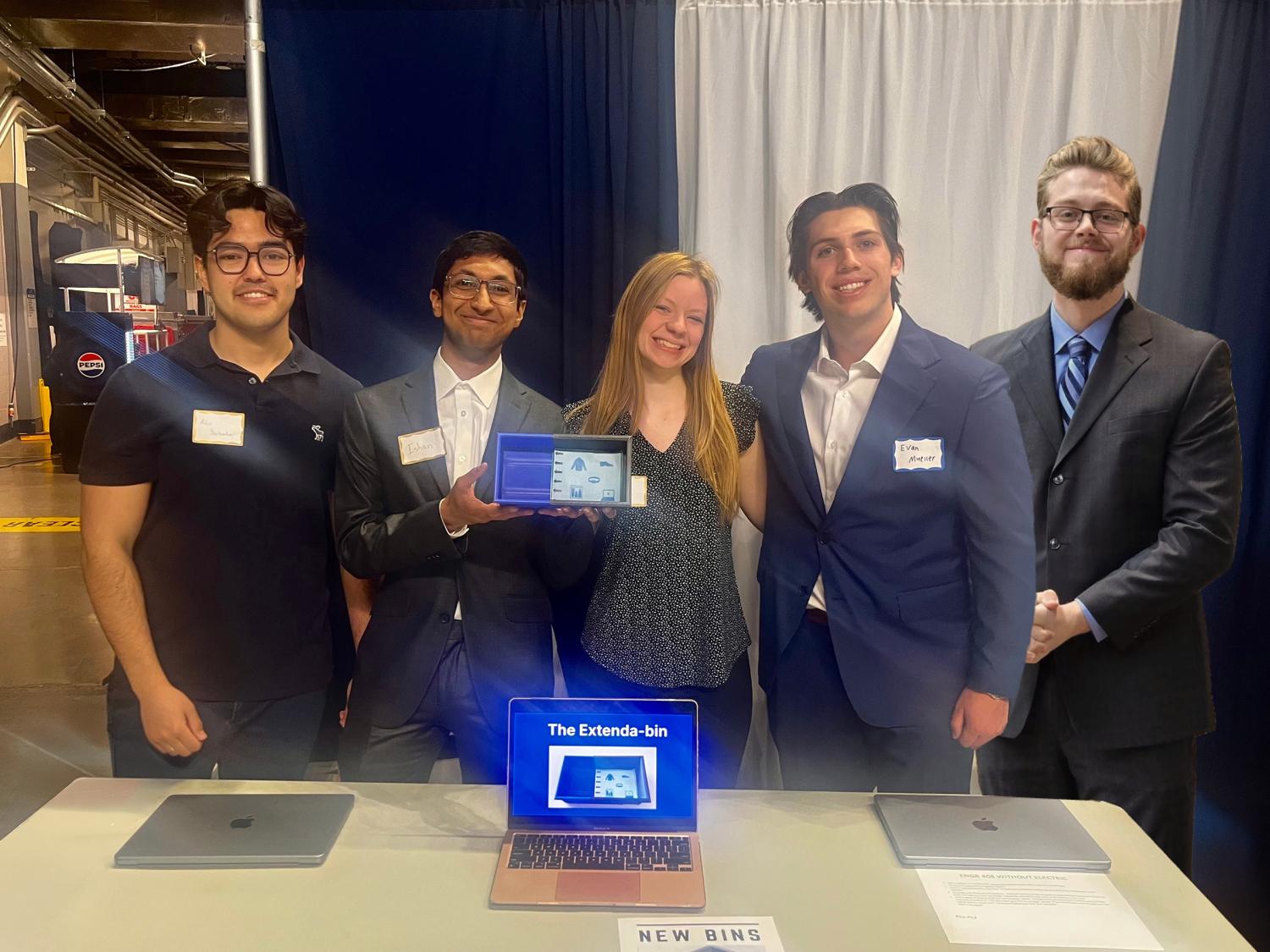 Five Penn State students pose with their Expanda-bin prototype 