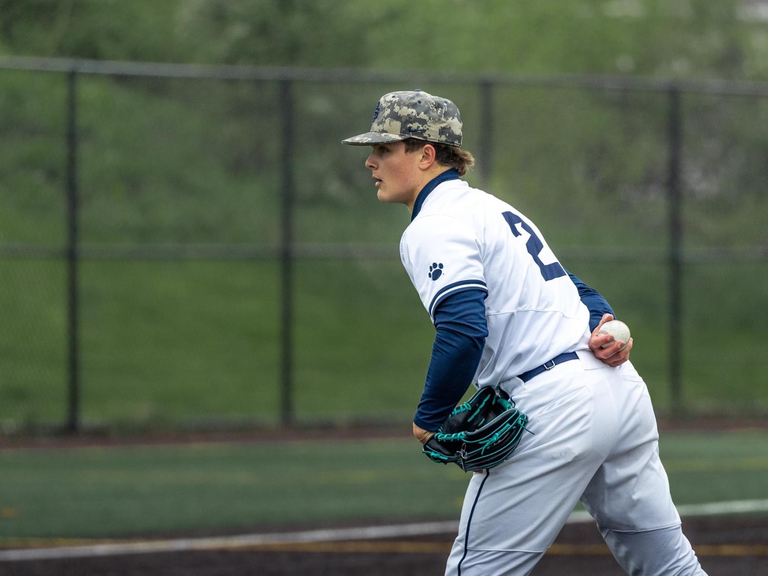 A pitcher for the Penn State Behrend baseball team prepares to throw the ball.