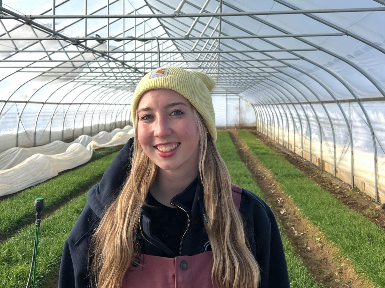 Brenna Fitzpatrick posing in growing greenhosue