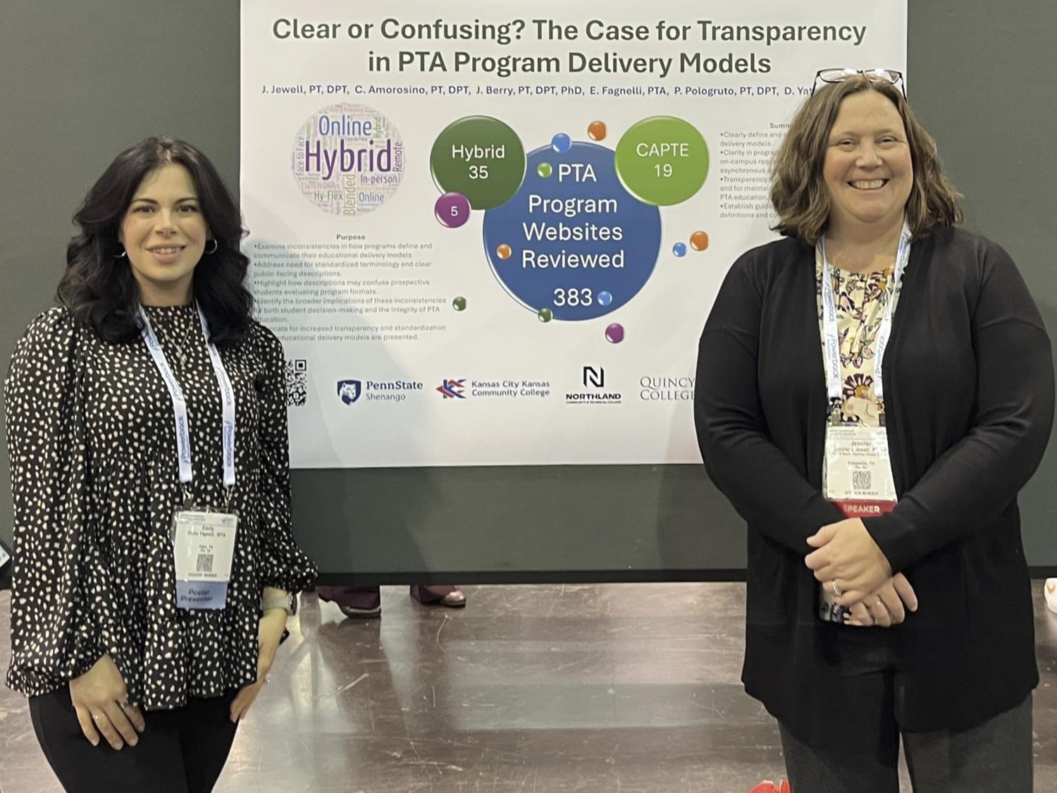 Emily Fagnelli and Jen Jewell pose for a photo in front of a poster presentation hanging between them.