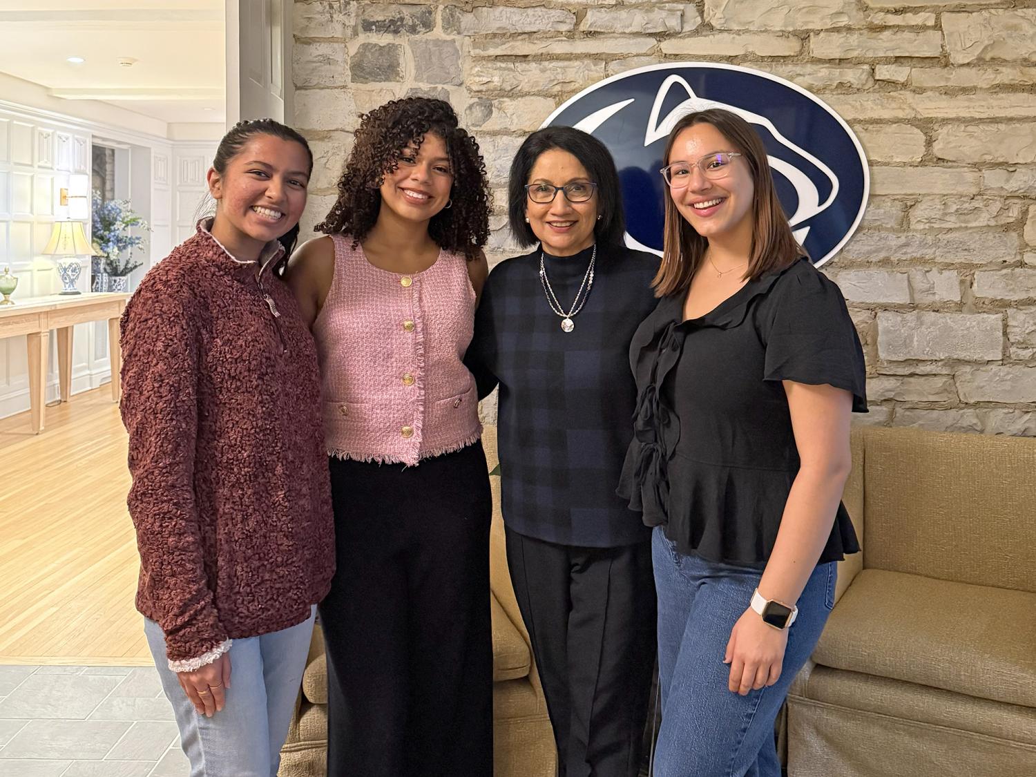 Students including Eva SinhaRoy meet with Penn State President