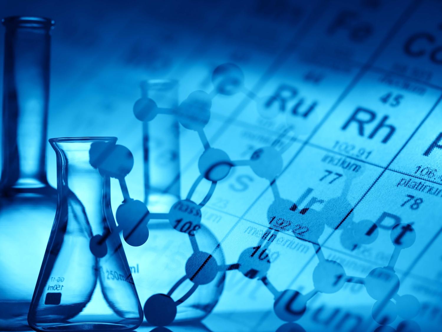 periodic table background with science equipment in front
