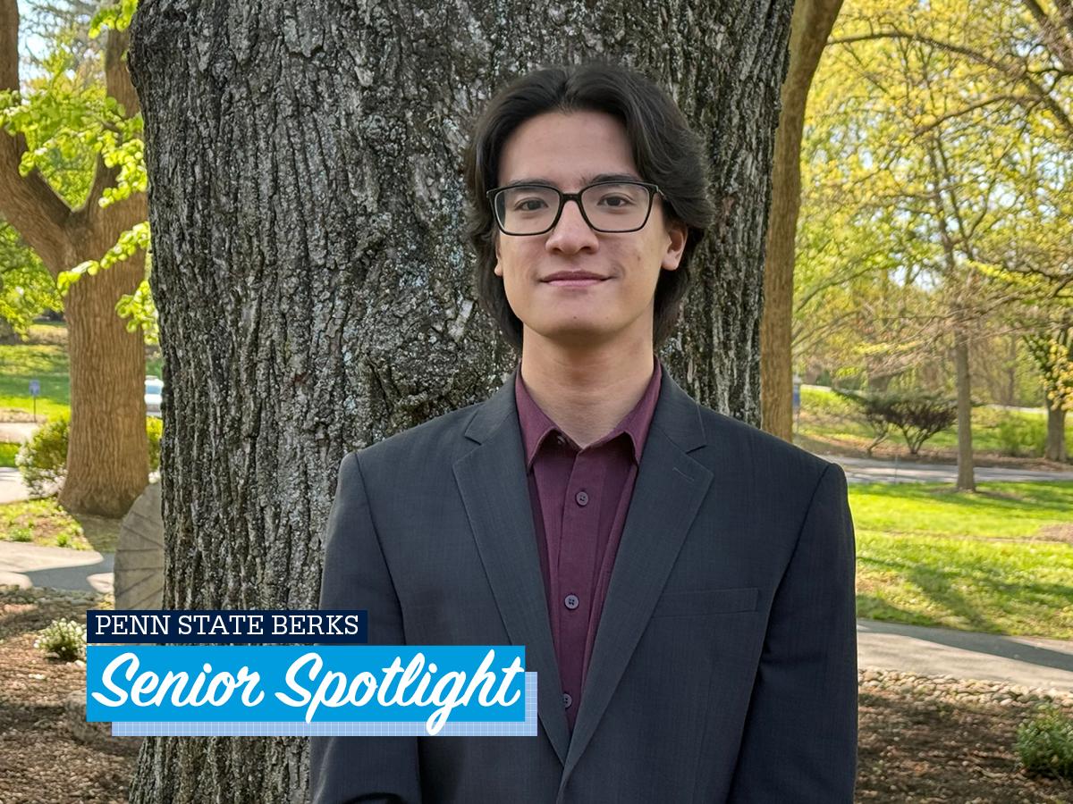 Headshot of Nathan Tam outside on campus
