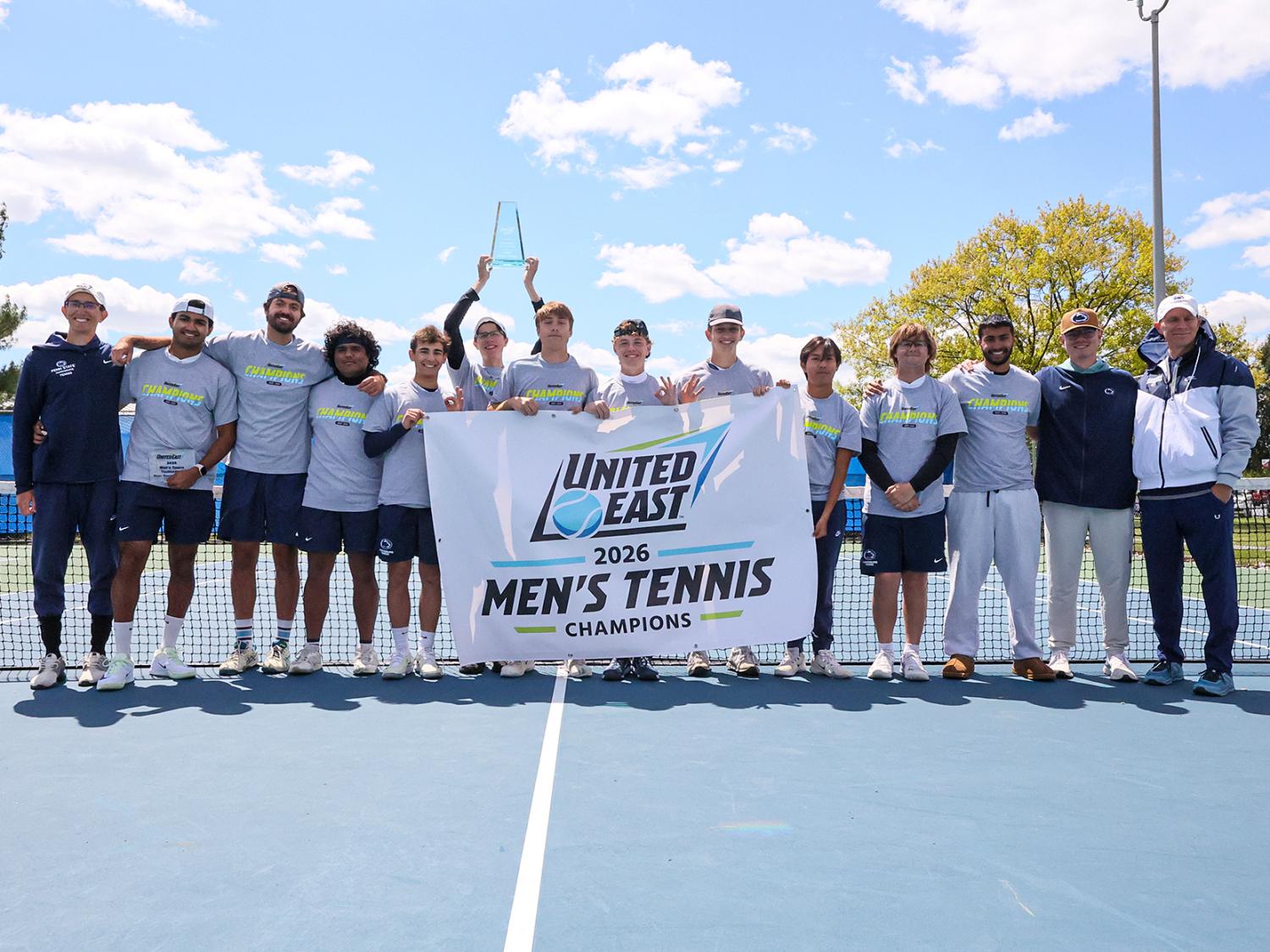Penn State Harrisburg men's tennis team holds a banner that says United East 2026 Men's Tennis Champions