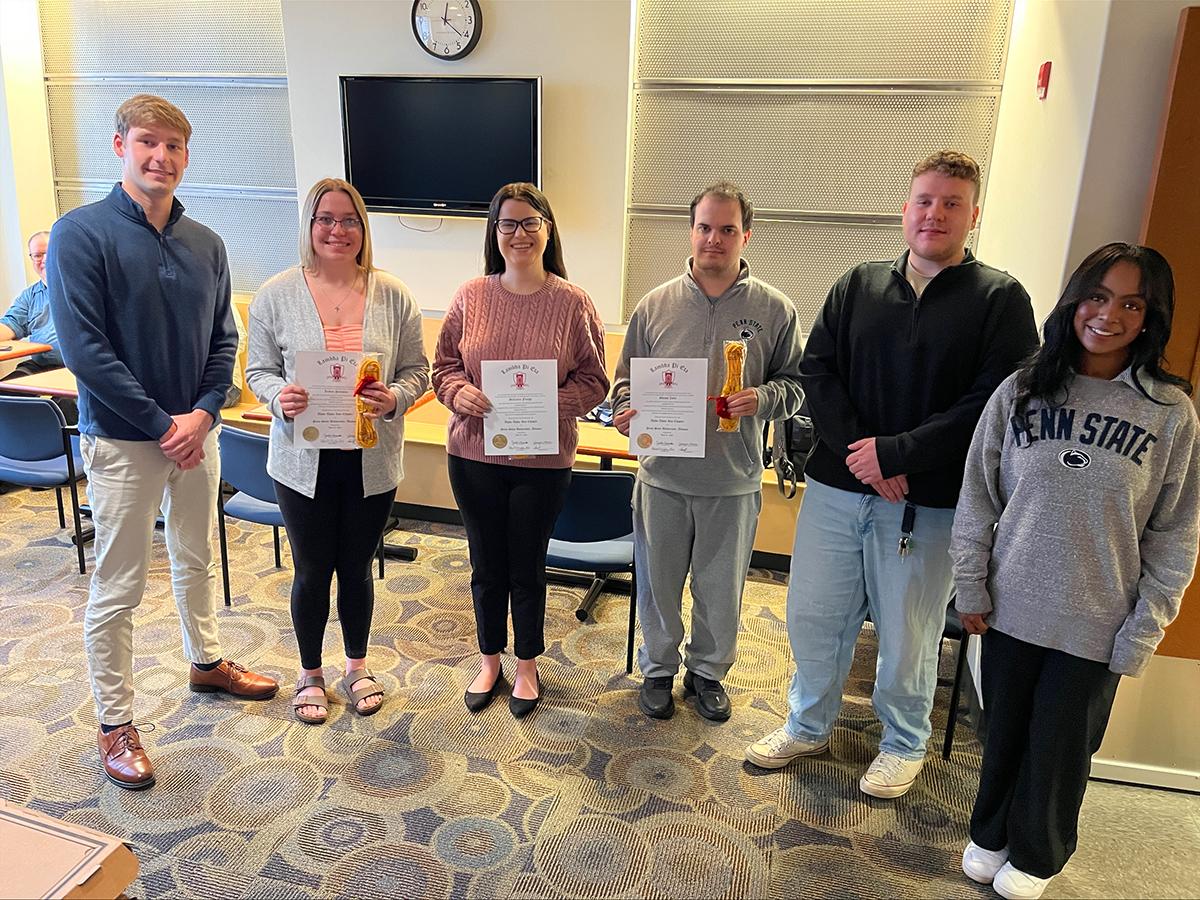 Students posing at an awards ceremony: Adam Dotts, Jaidyn Palladini, McCailey Flaugh, Shaun Zafar, Sean Webb and Lissette Green.