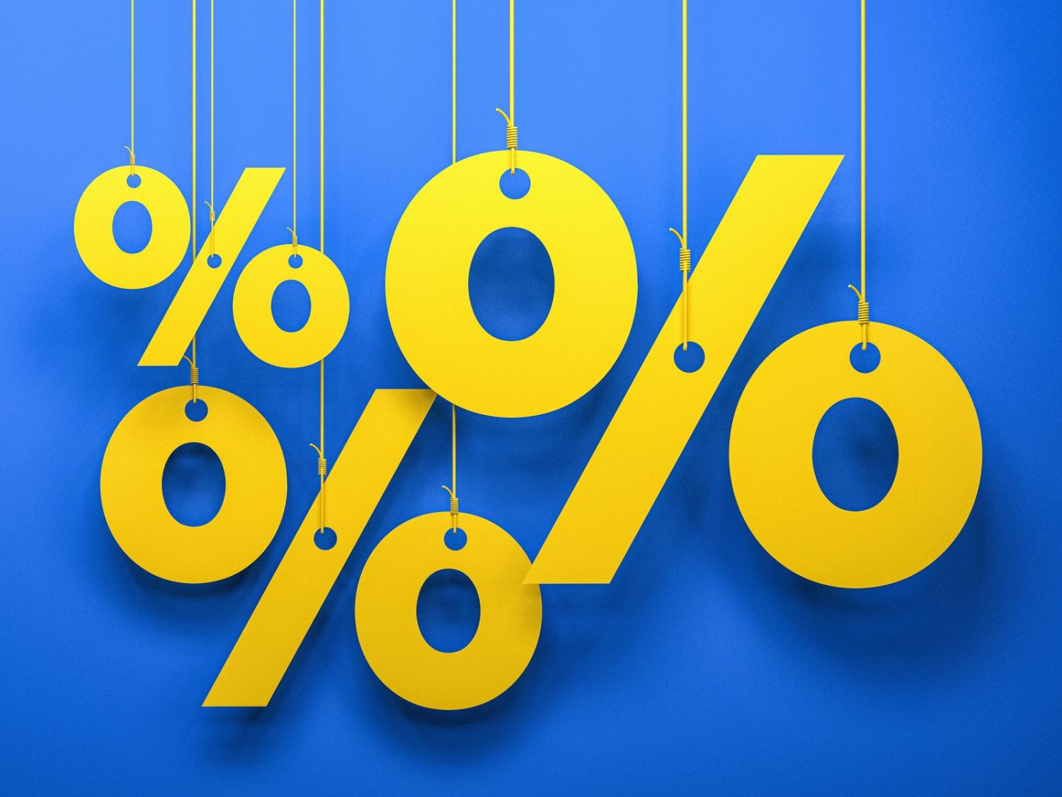 Three yellow percentage signs hanging from strings against a blue background.